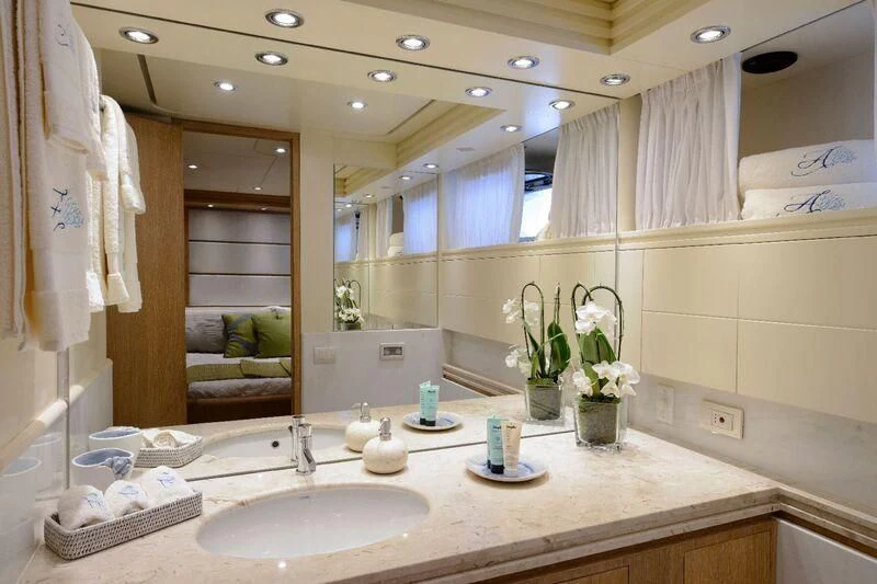 a bathroom with a large mirror aboard AMAYA Yacht for Sale