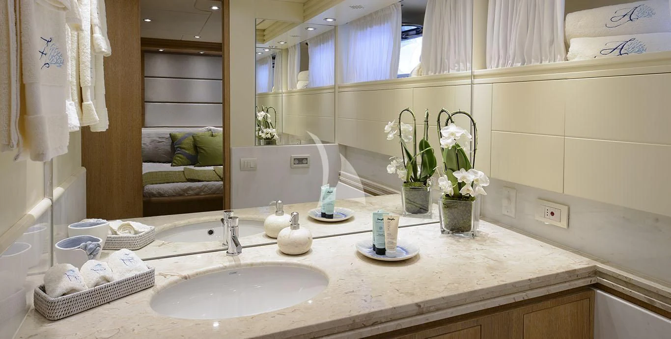 a bathroom with a sink and a mirror aboard AMAYA Yacht for Sale