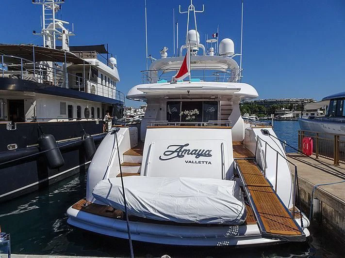 a boat docked at a pier aboard AMAYA Yacht for Sale