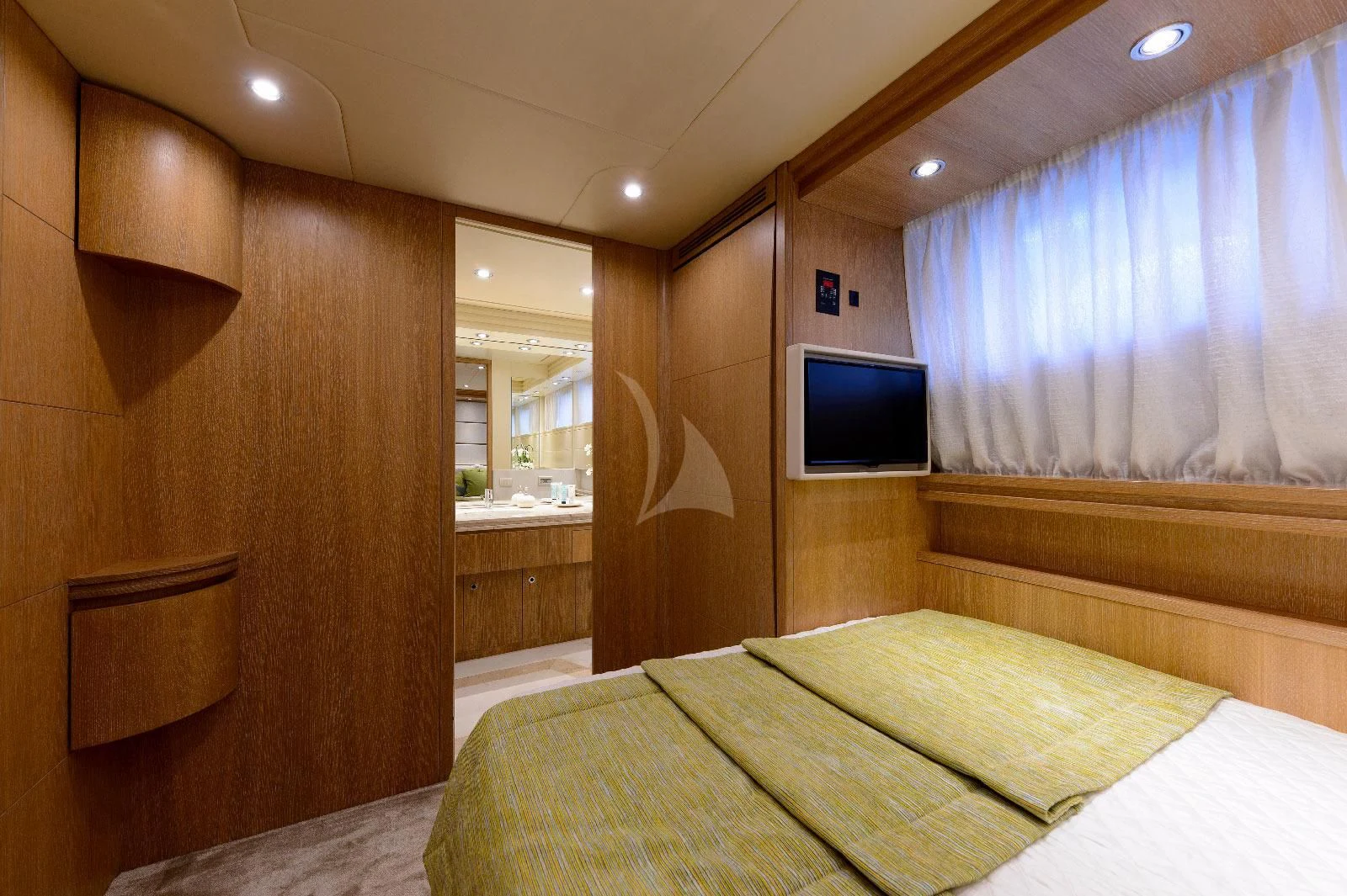 a room with a bed and a tv aboard AMAYA Yacht for Sale