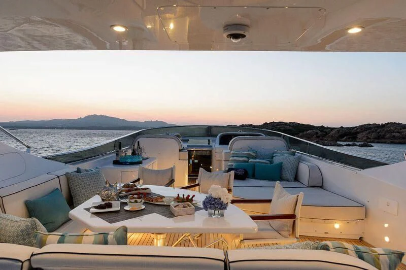 a room with a table and chairs aboard AMAYA Yacht for Sale