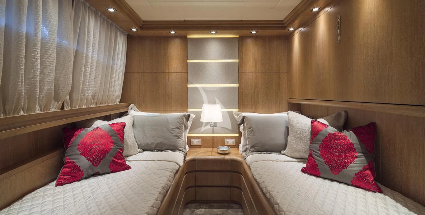 a room with two beds aboard AMAYA Yacht for Sale