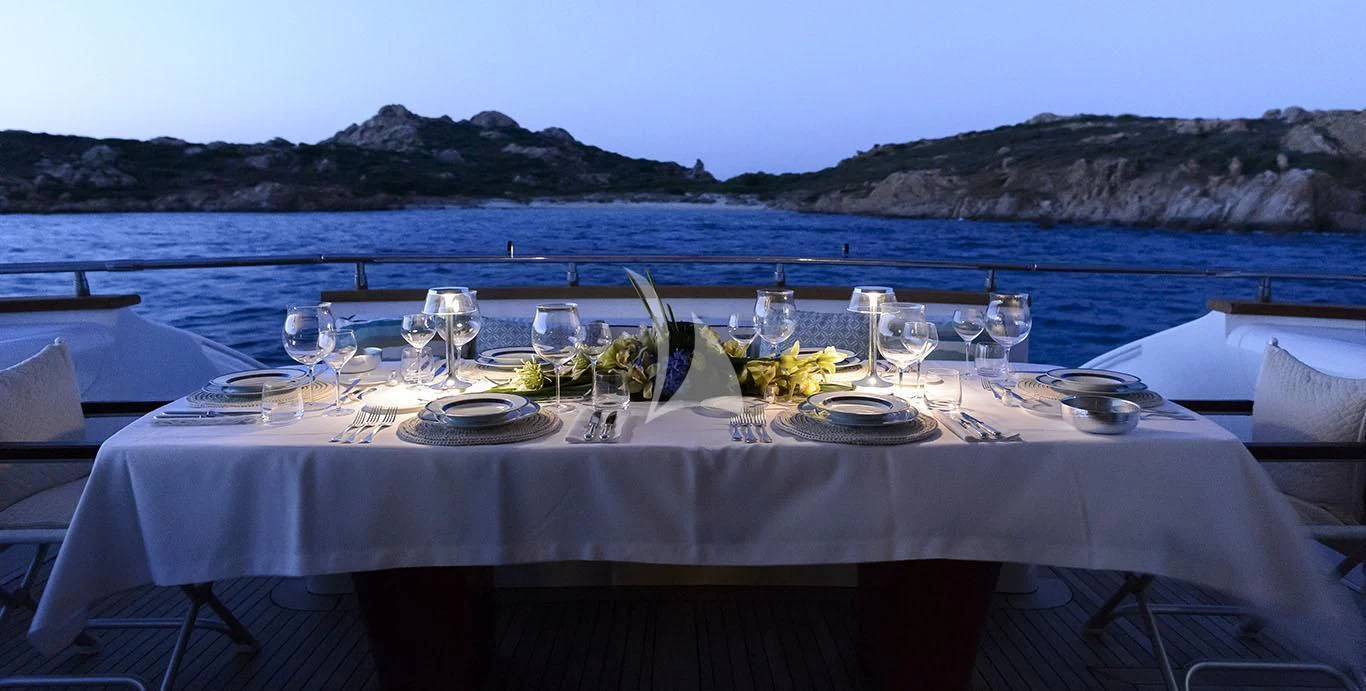 a table set for a dinner aboard AMAYA Yacht for Sale