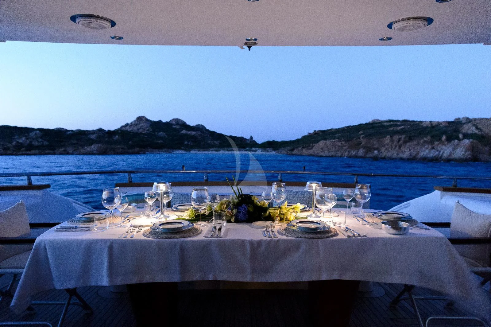 a table set for a dinner aboard AMAYA Yacht for Sale
