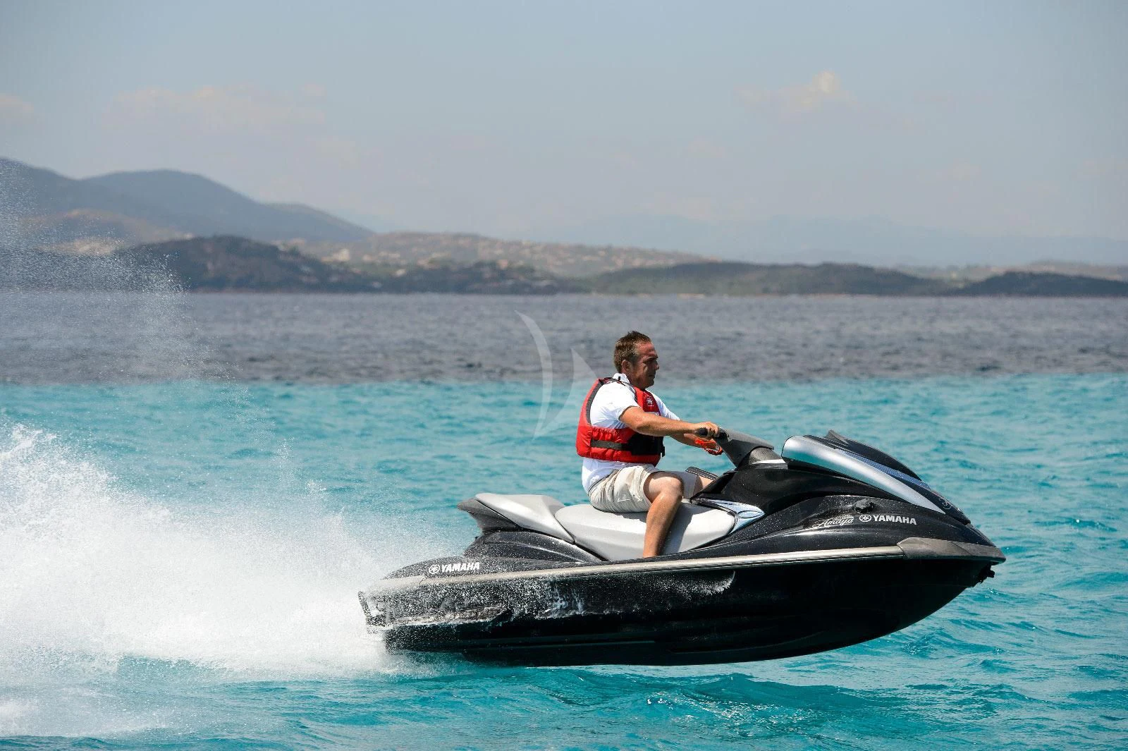 a man on a jet ski aboard AMAYA Yacht for Sale