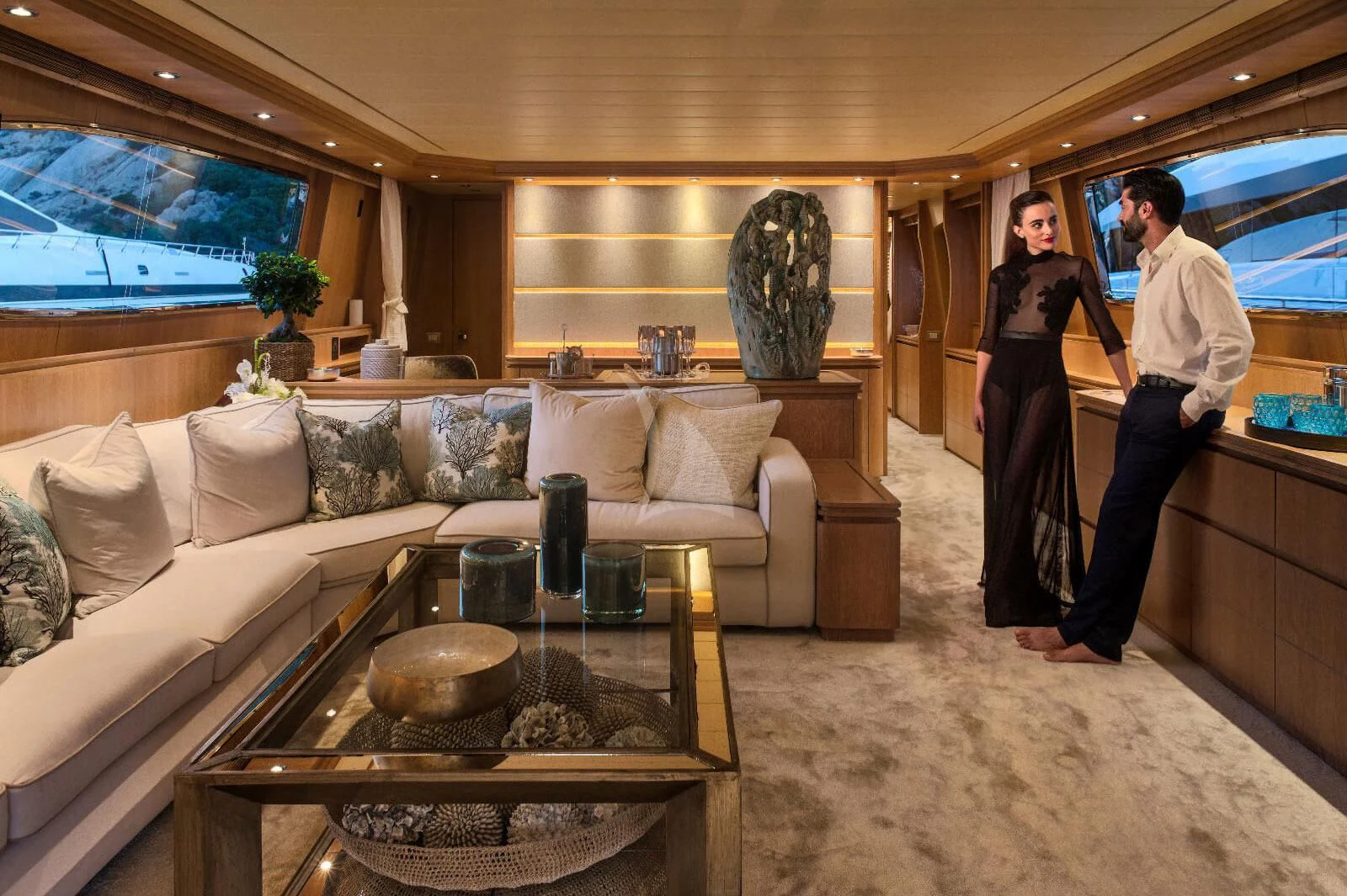 a couple of people standing in a living room aboard AMAYA Yacht for Sale