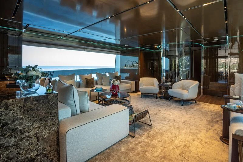 a room with a couch and a table and chairs aboard PANAME Yacht for Sale
