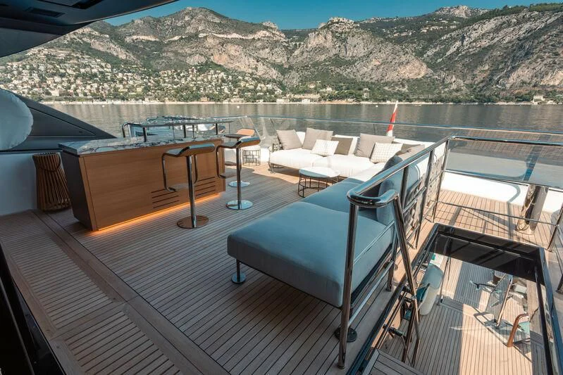 a balcony with a view of a lake and mountains aboard PANAME Yacht for Sale