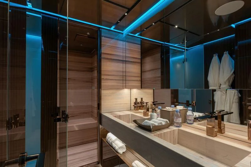 a bathroom with a large mirror aboard PANAME Yacht for Sale