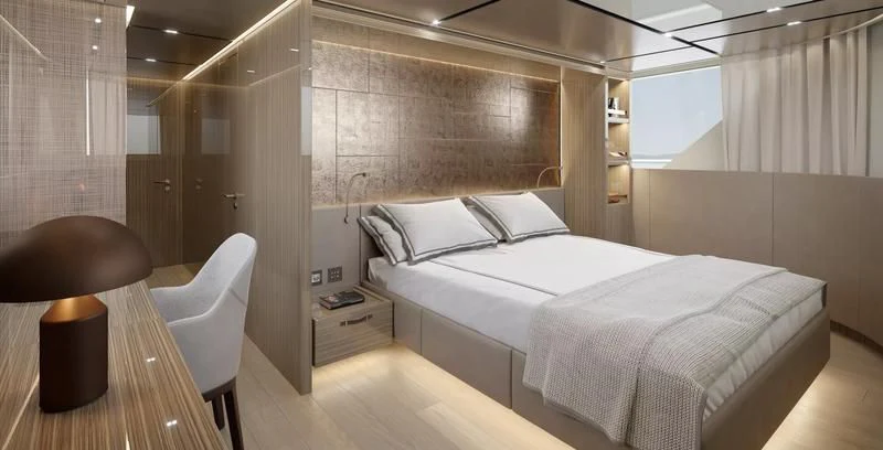 a room with a bed and a chair aboard PANAME Yacht for Sale