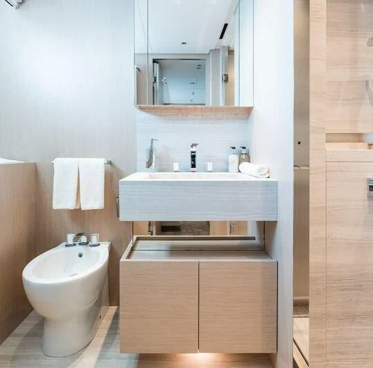 a bathroom with a sink and a mirror aboard PANAME Yacht for Sale