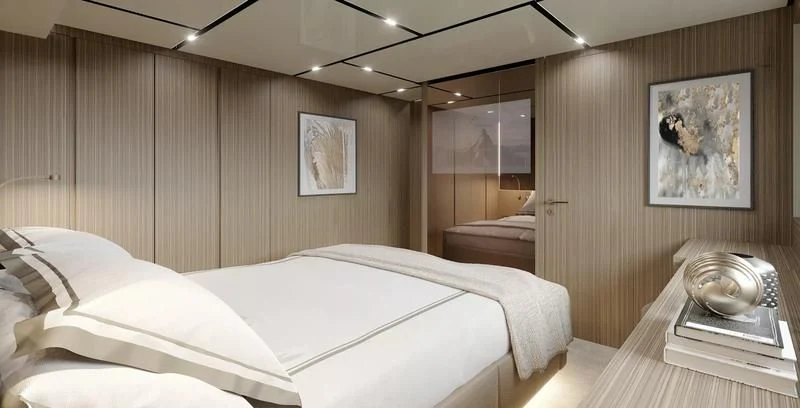 a room with a bed and a mirror aboard PANAME Yacht for Sale
