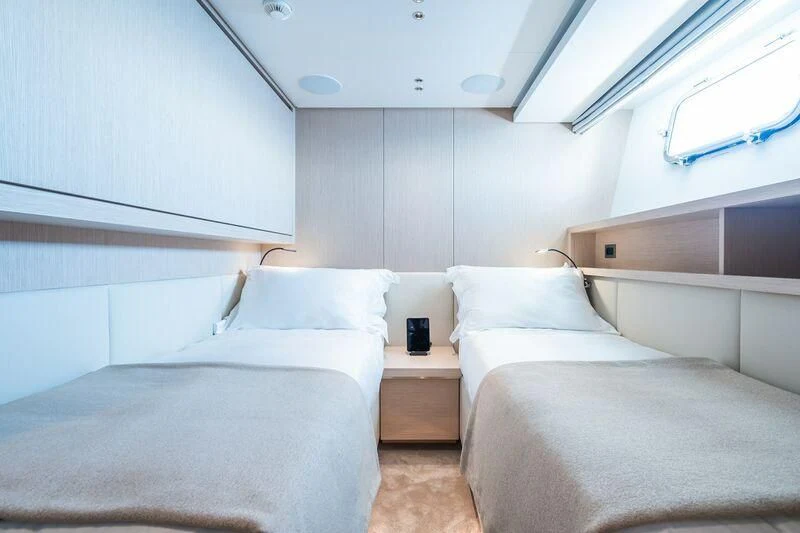 a room with beds and a window aboard PANAME Yacht for Sale