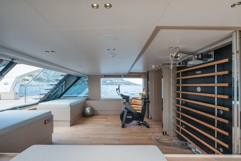 a room with a large window and a large bed aboard PANAME Yacht for Sale