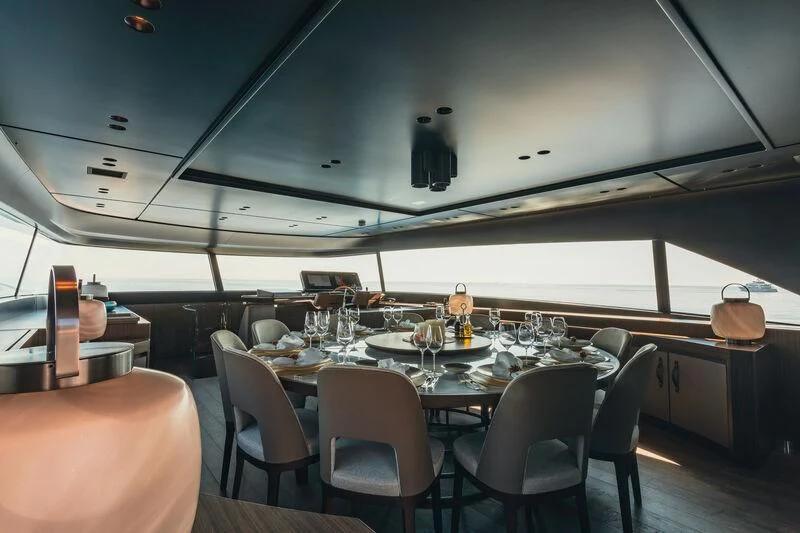 a large dining room with a large table and chairs aboard PANAME Yacht for Sale