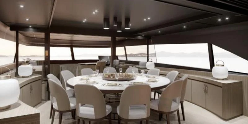 a dining room with a table and chairs aboard PANAME Yacht for Sale