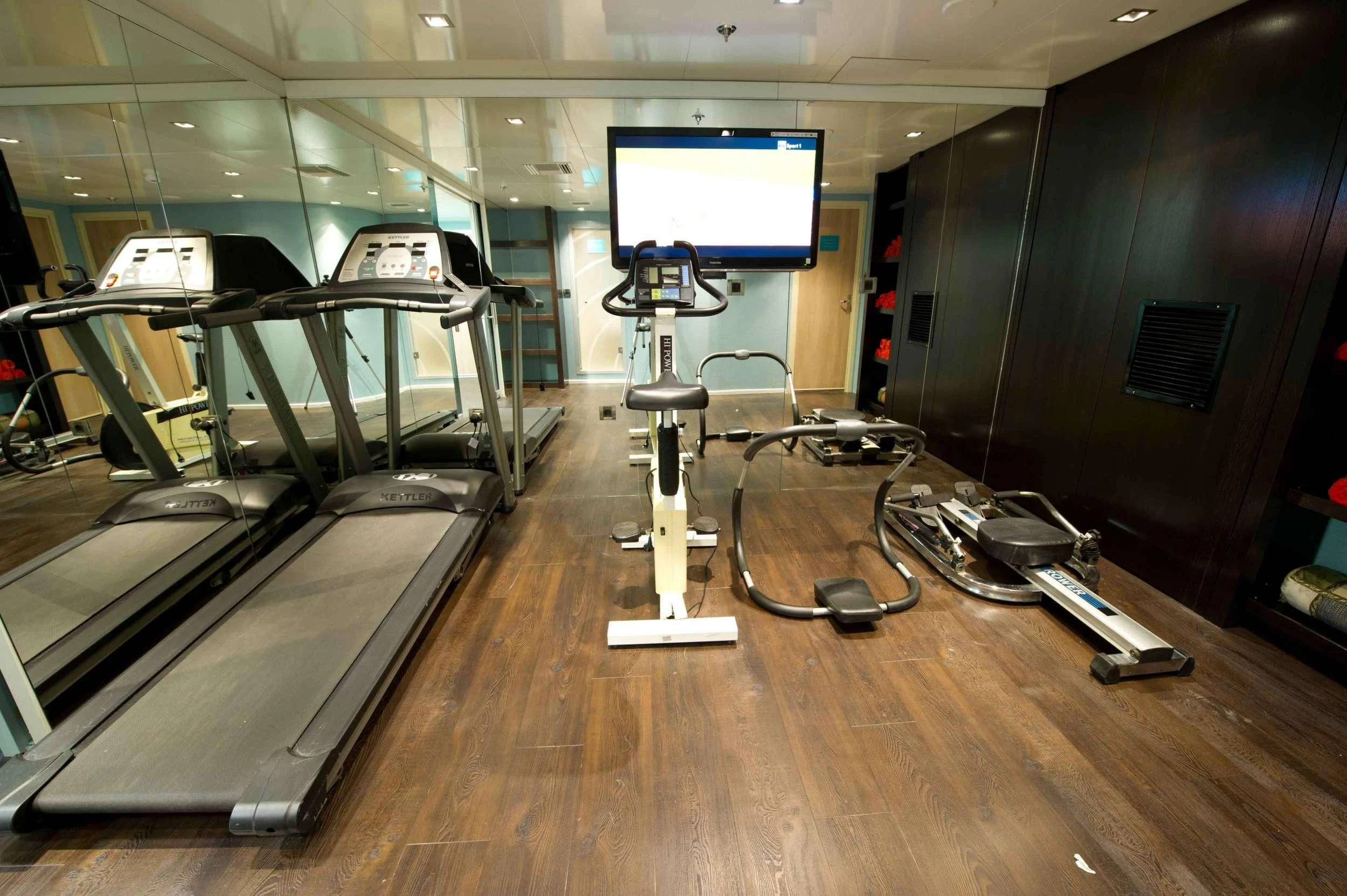 a gym with equipment and equipment aboard VARIETY VOYAGER Yacht for Sale