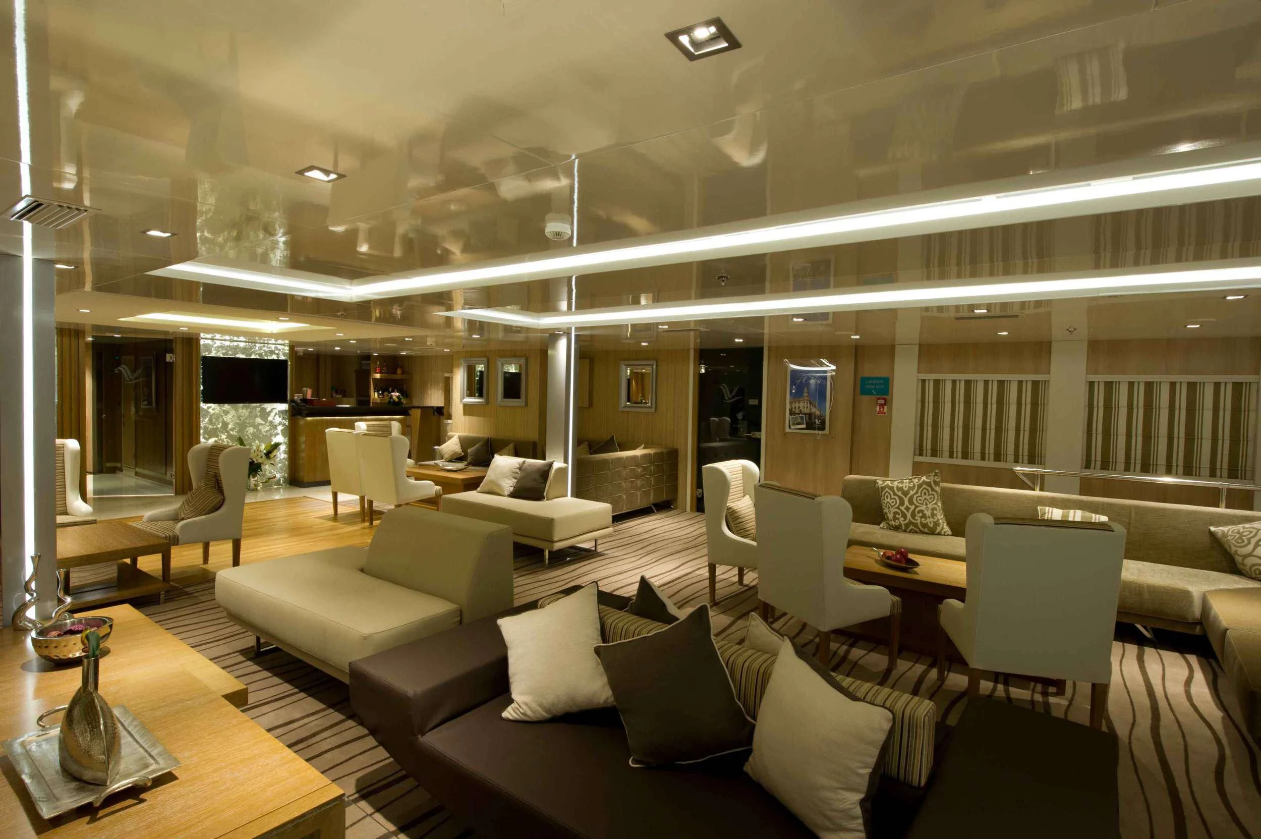 a living room with a large window aboard VARIETY VOYAGER Yacht for Sale
