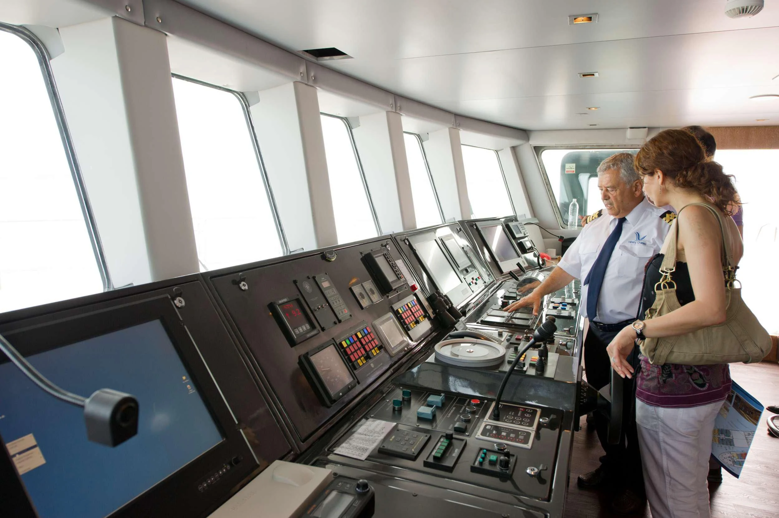 a man and woman in a room with machines aboard VARIETY VOYAGER Yacht for Sale