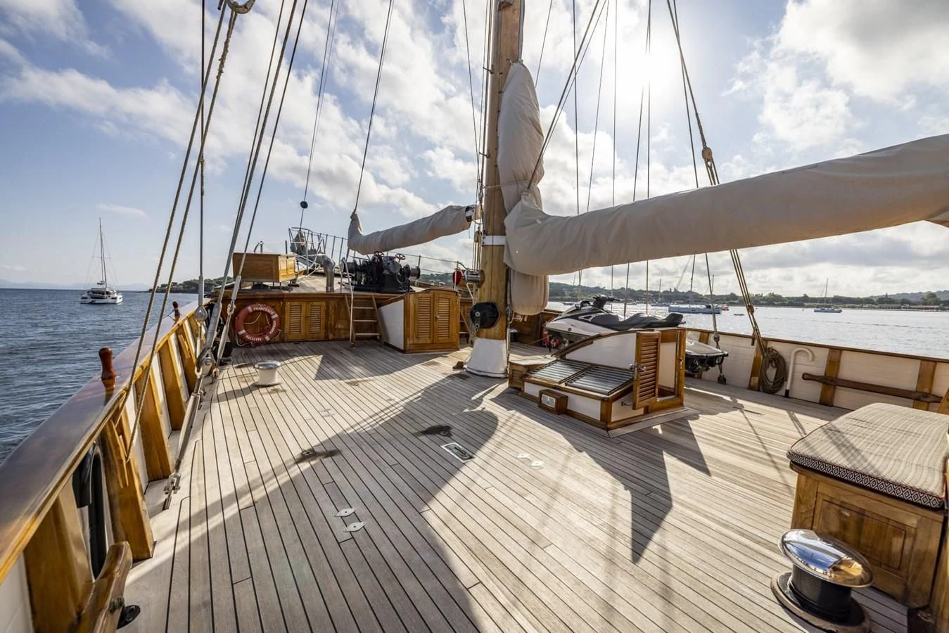 a deck with a boat and a dock with a boat on it aboard FRANCESCO PETRARCA Yacht for Sale