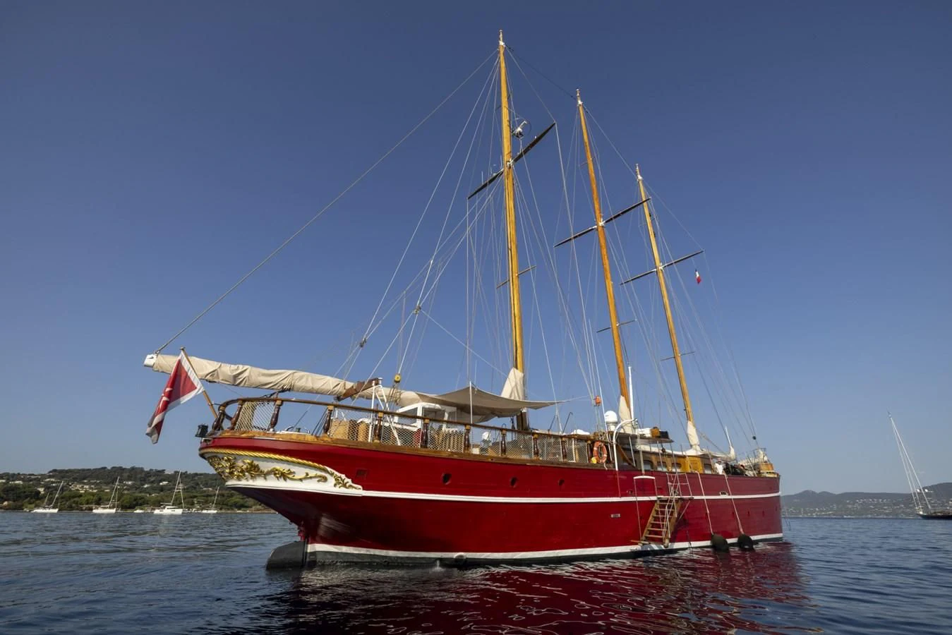 a red and yellow boat on the water aboard FRANCESCO PETRARCA Yacht for Sale