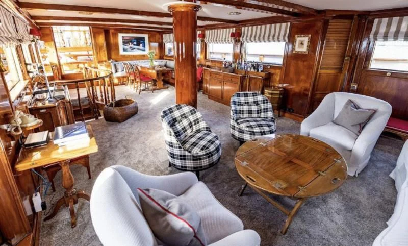 a living room with a wood floor aboard FRANCESCO PETRARCA Yacht for Sale