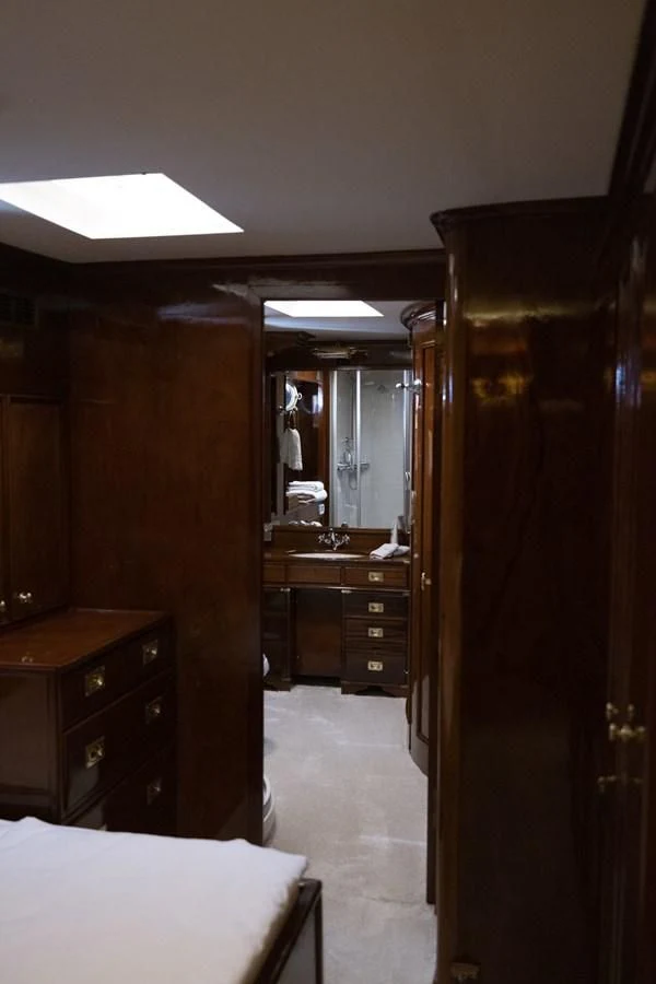 a bedroom with a closet and a bed aboard FRANCESCO PETRARCA Yacht for Sale