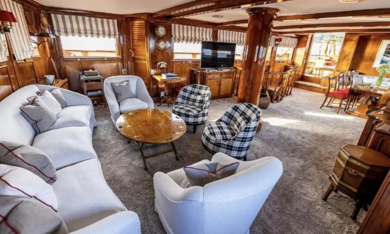 a living room with a large window aboard FRANCESCO PETRARCA Yacht for Sale