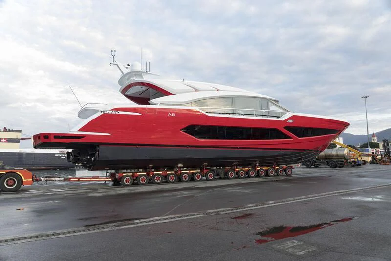 a large red and white airplane aboard VINTAG Yacht for Sale