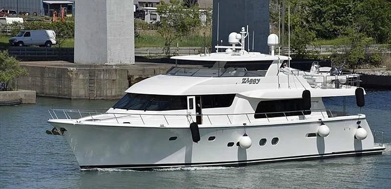 a white boat in a body of water aboard CHERRY BOMB Yacht for Sale