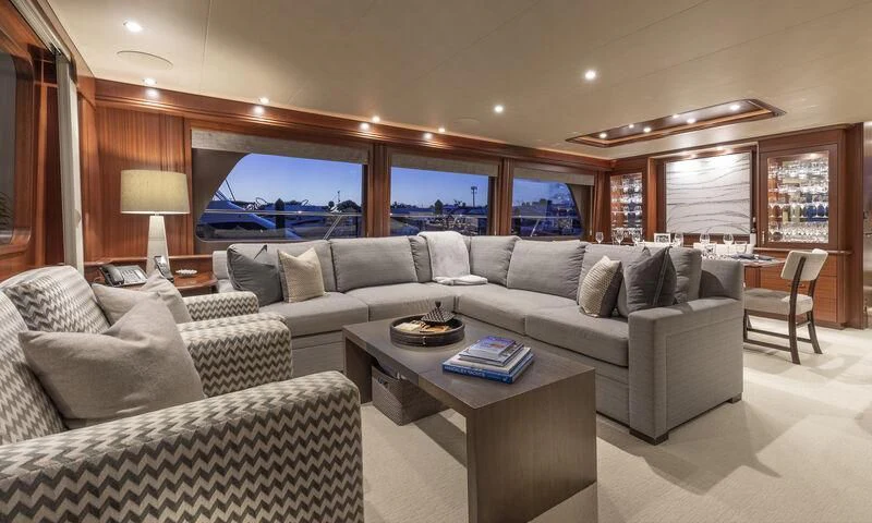 a living room with a large sofa and a large television aboard CHERRY BOMB Yacht for Sale