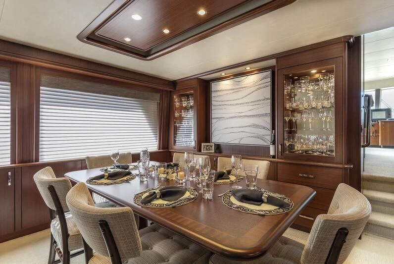 a dining room with a table aboard CHERRY BOMB Yacht for Sale