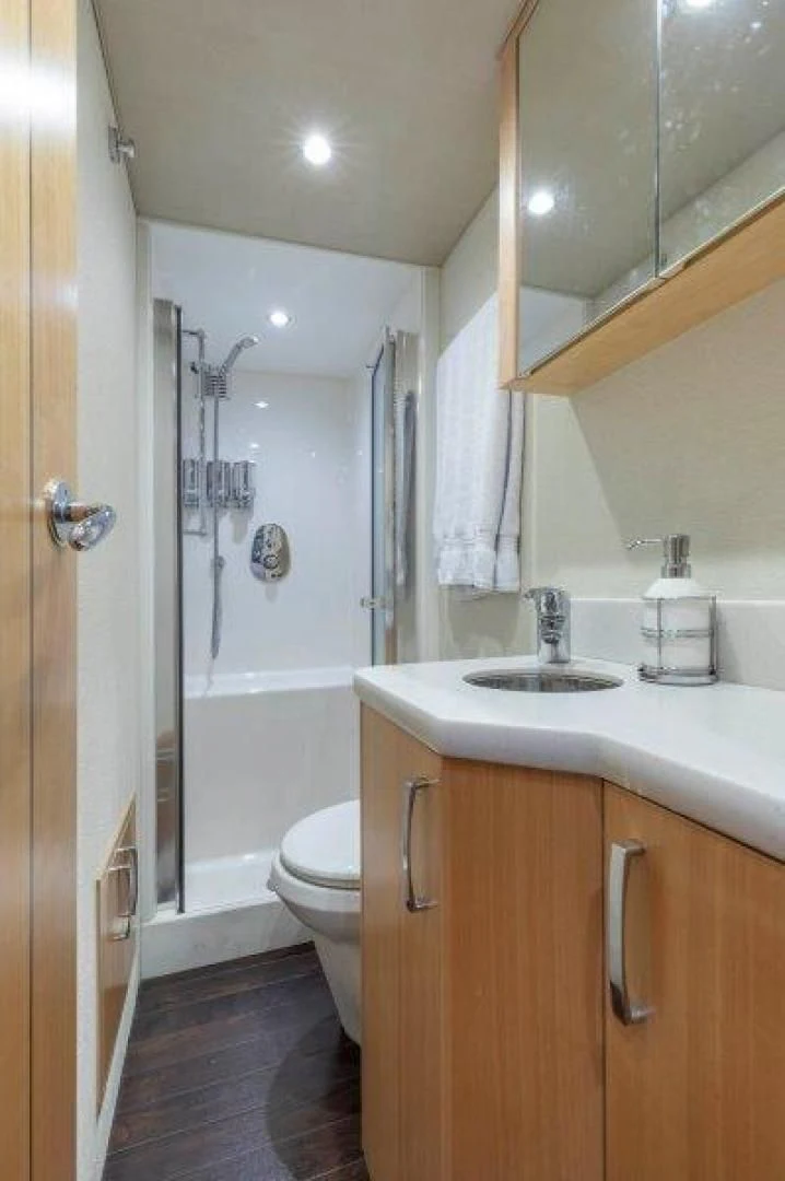 a bathroom with a sink and a toilet aboard CHERRY BOMB Yacht for Sale