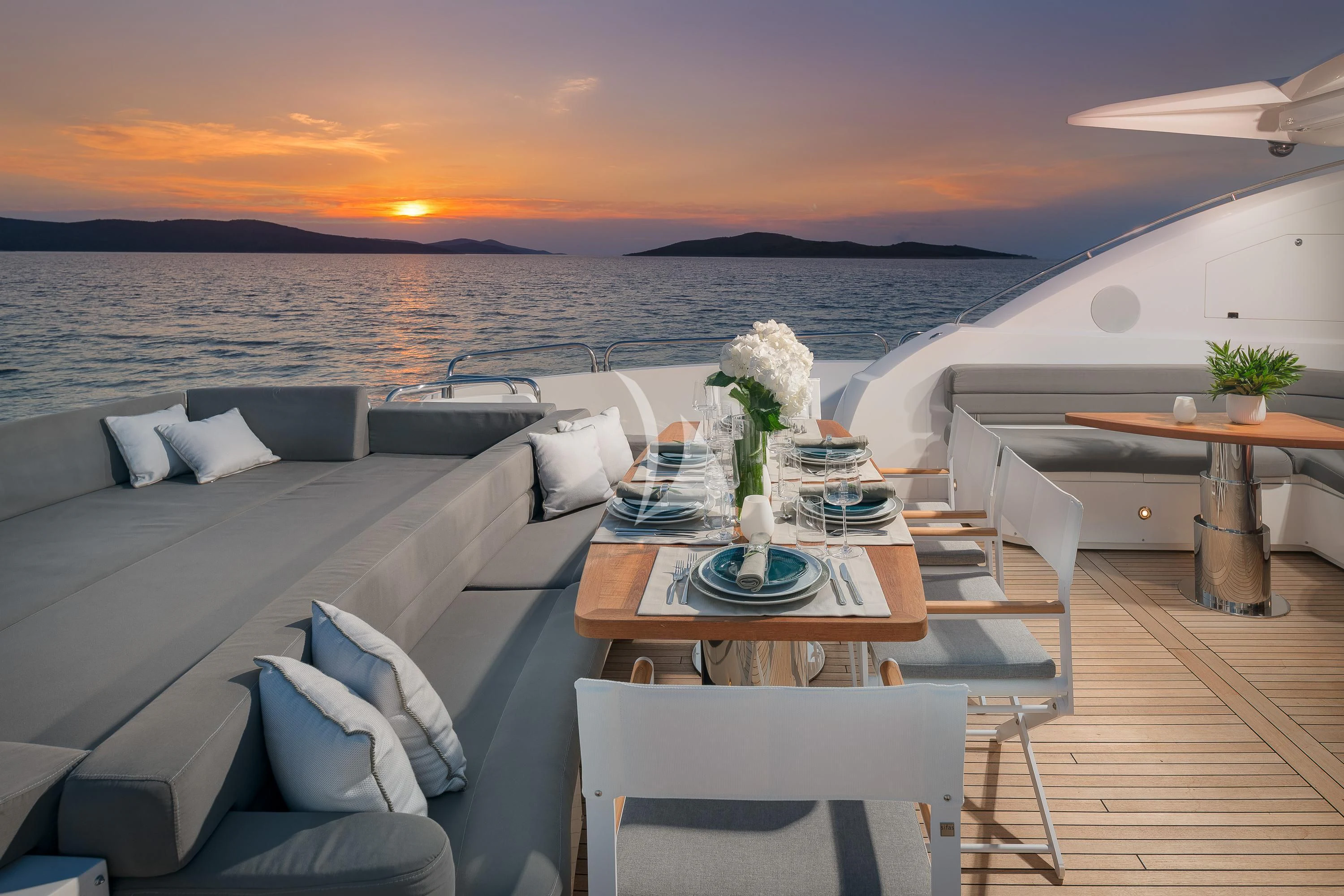 a room with a table and chairs aboard QUANTUM Yacht for Sale
