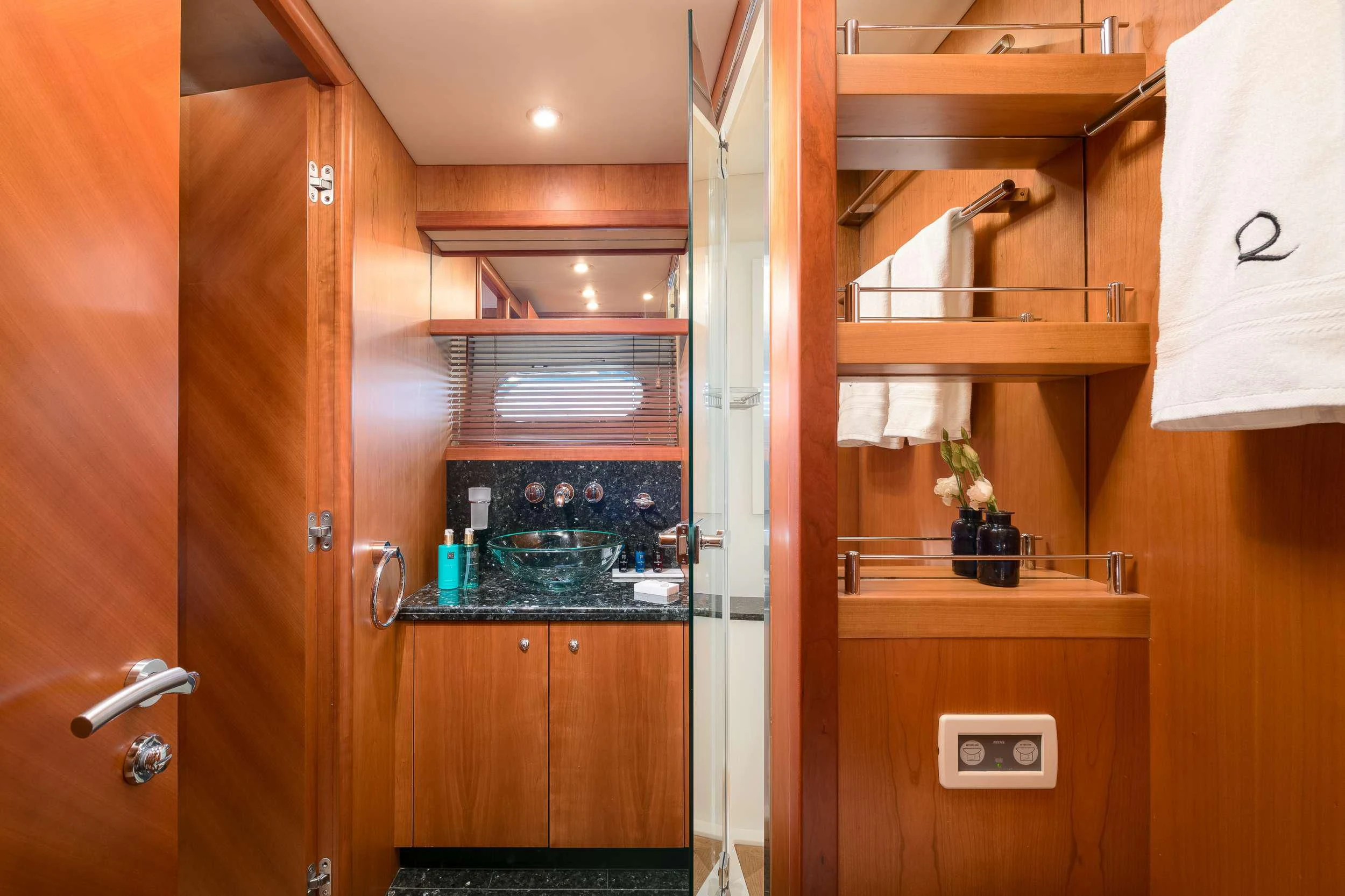a kitchen with wooden cabinets aboard QUANTUM Yacht for Sale