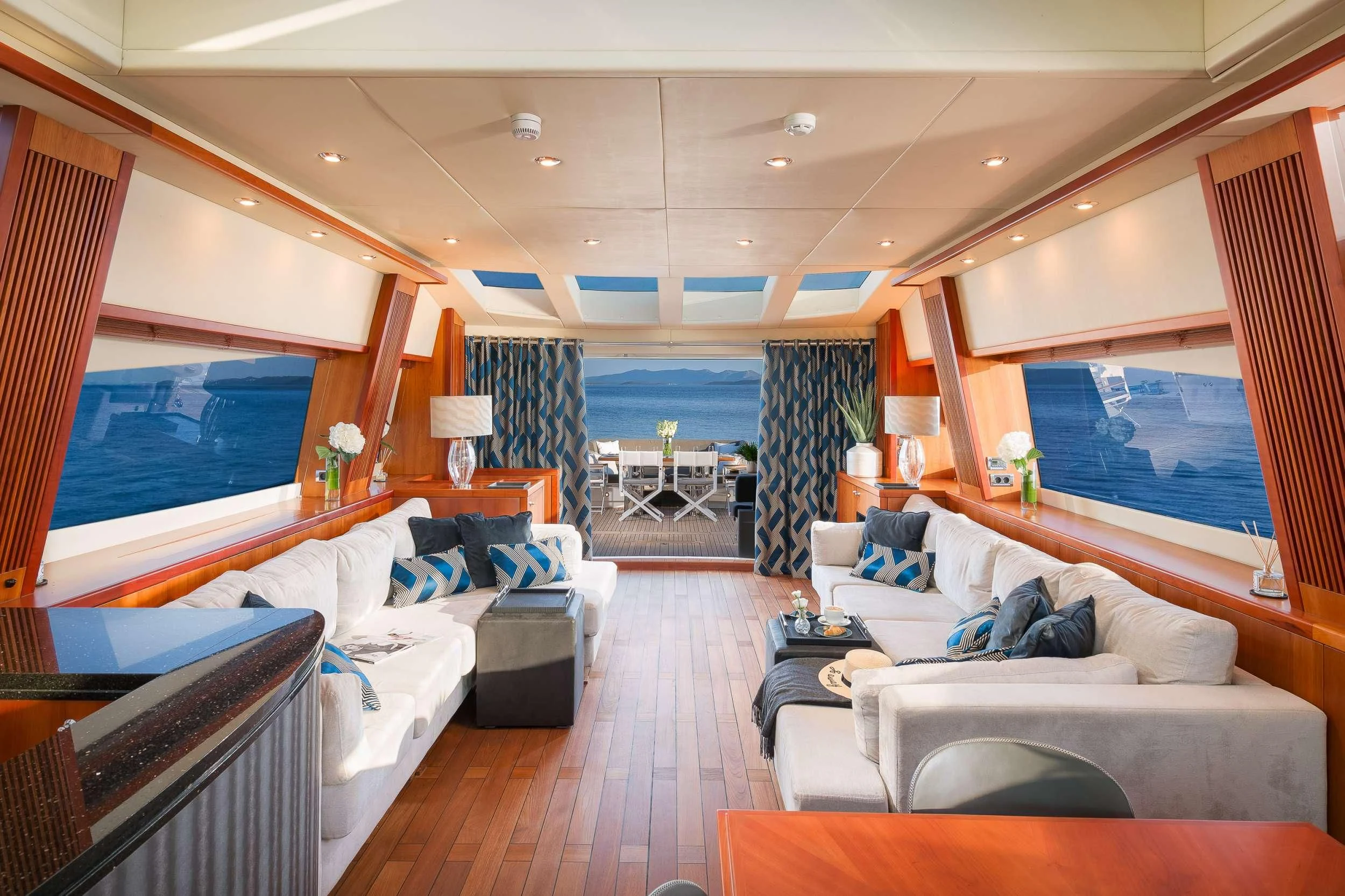 a room with a large window and a balcony aboard QUANTUM Yacht for Sale
