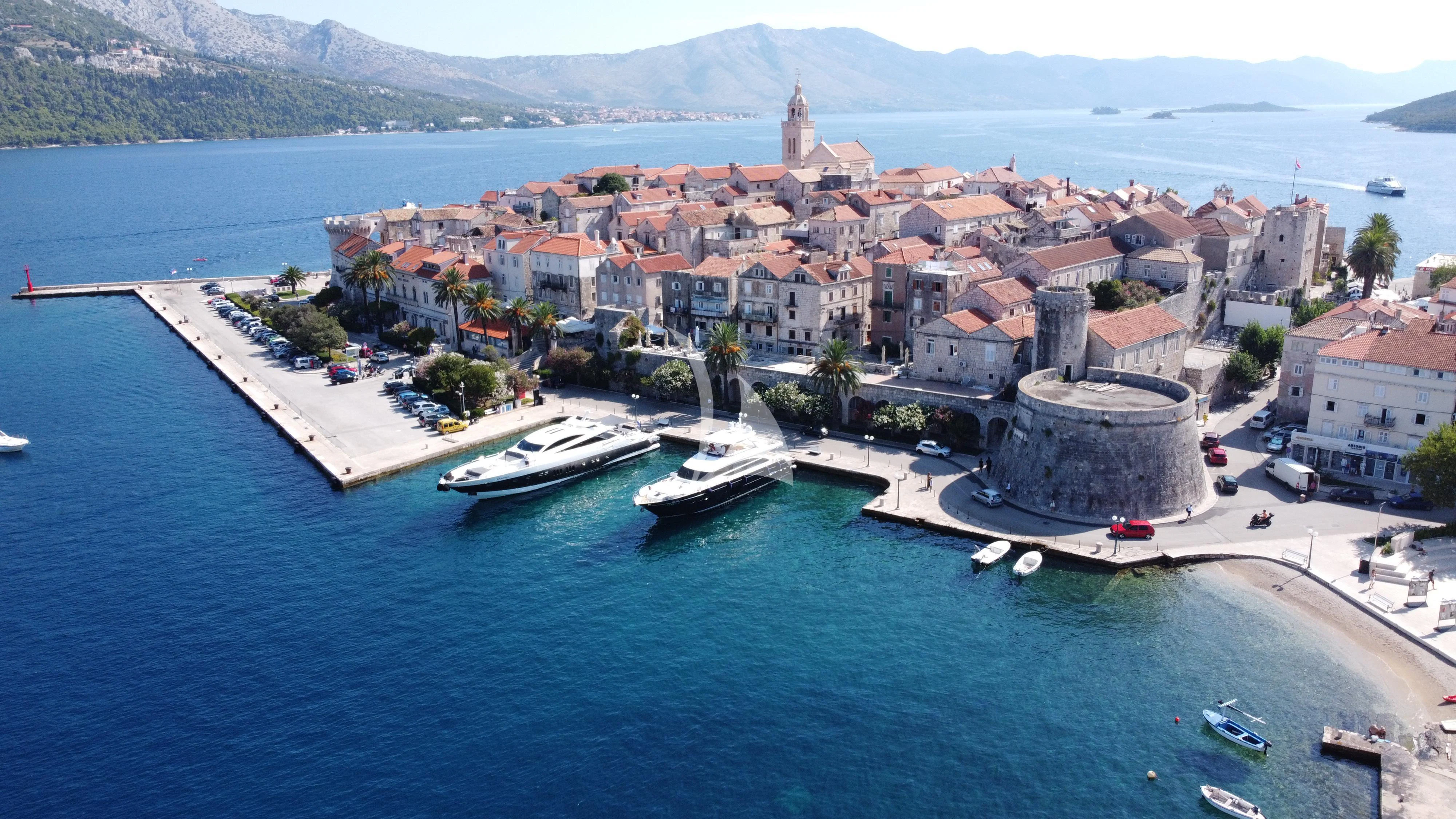 a city next to a body of water aboard QUANTUM Yacht for Sale