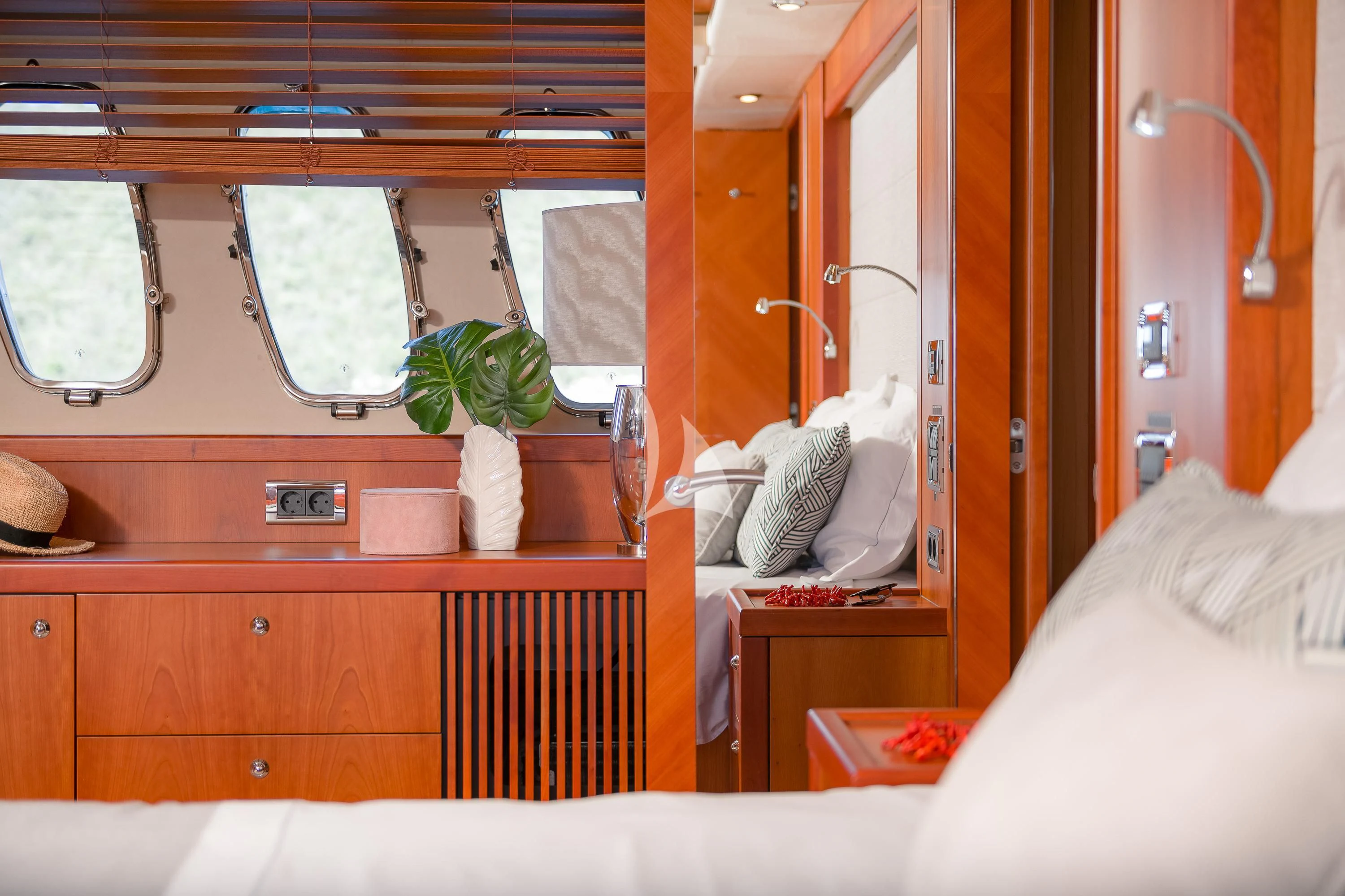 a room with a bed and a mirror aboard QUANTUM Yacht for Sale