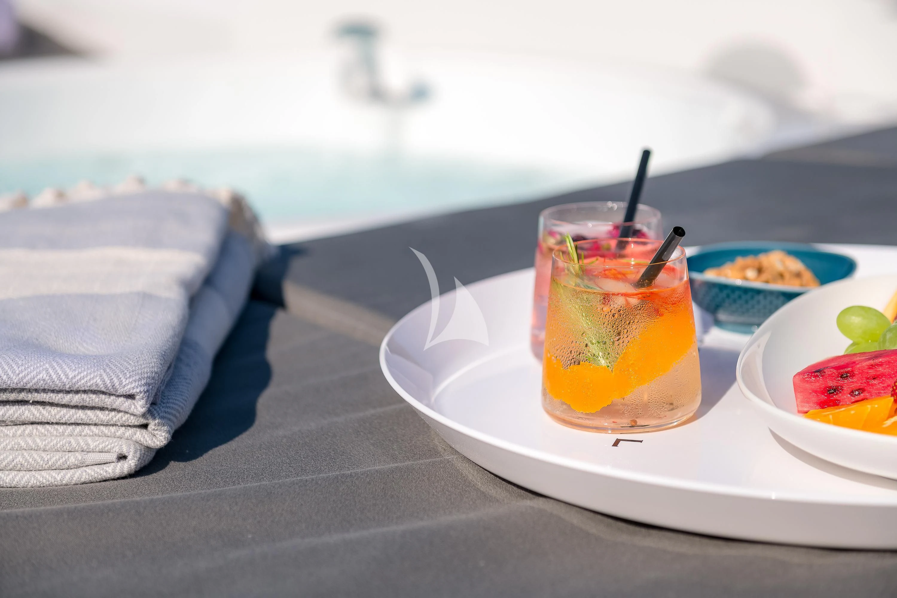 a plate of food on a table aboard QUANTUM Yacht for Sale