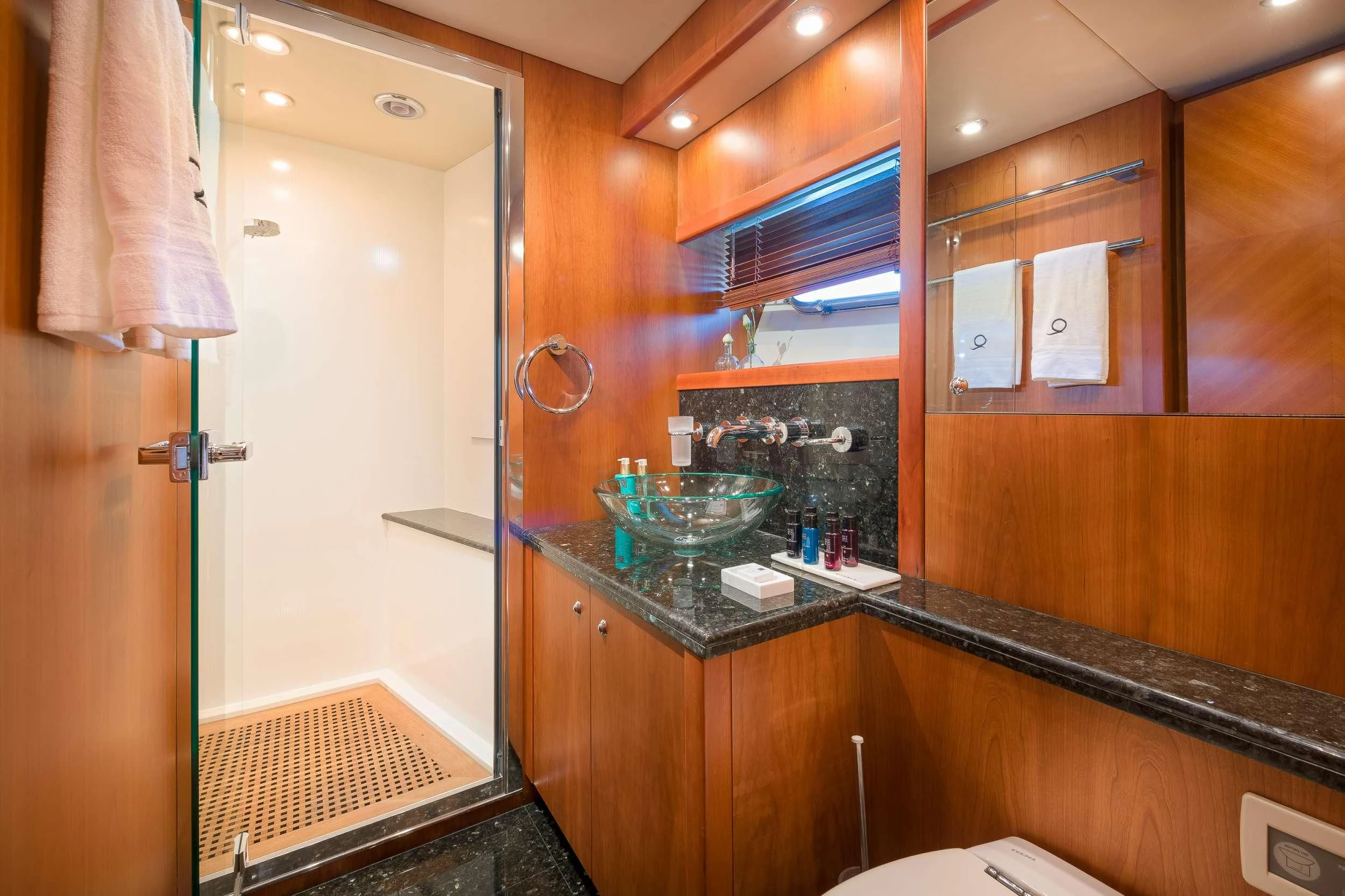 a bathroom with a glass counter aboard QUANTUM Yacht for Sale