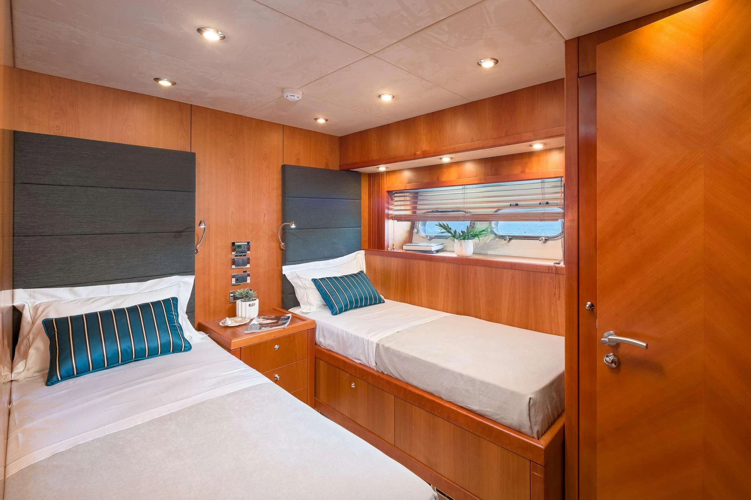 a room with two beds aboard QUANTUM Yacht for Sale