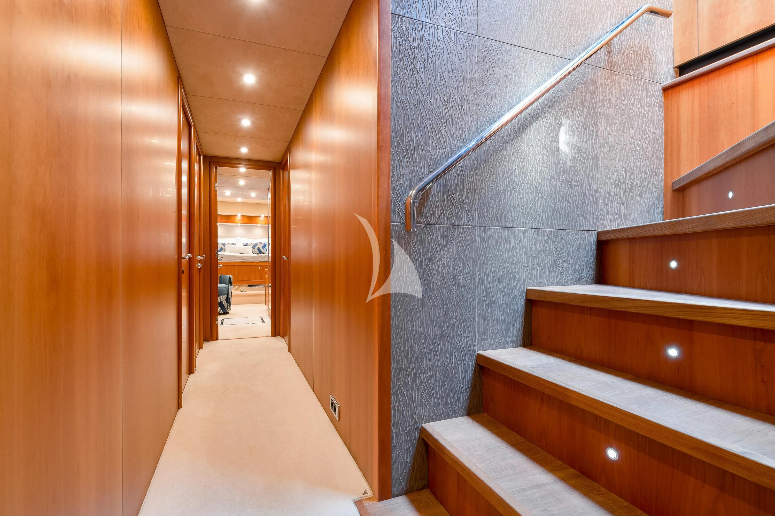 a bathroom with wooden cabinets aboard QUANTUM Yacht for Sale