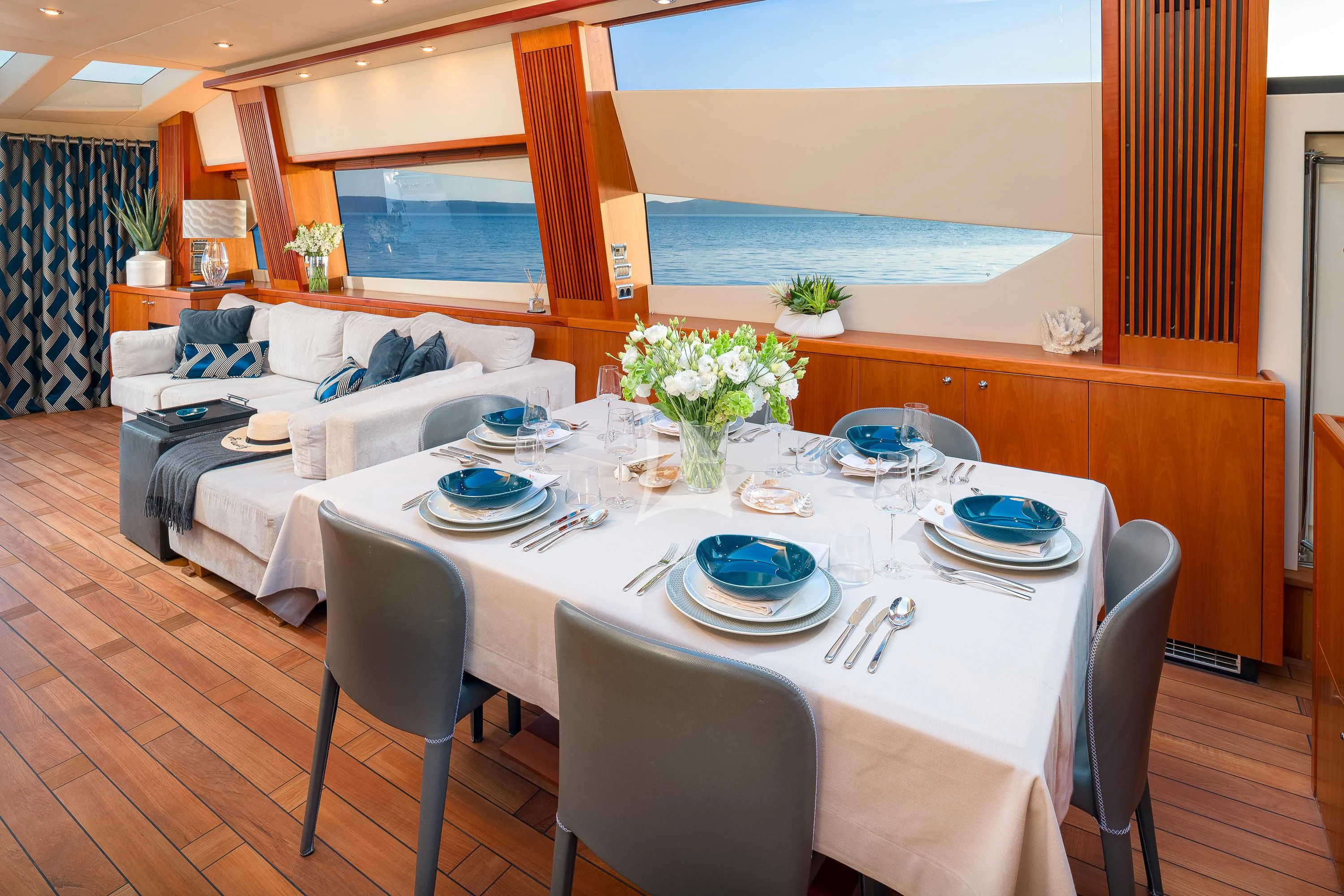 a dining table set for a dinner aboard QUANTUM Yacht for Sale