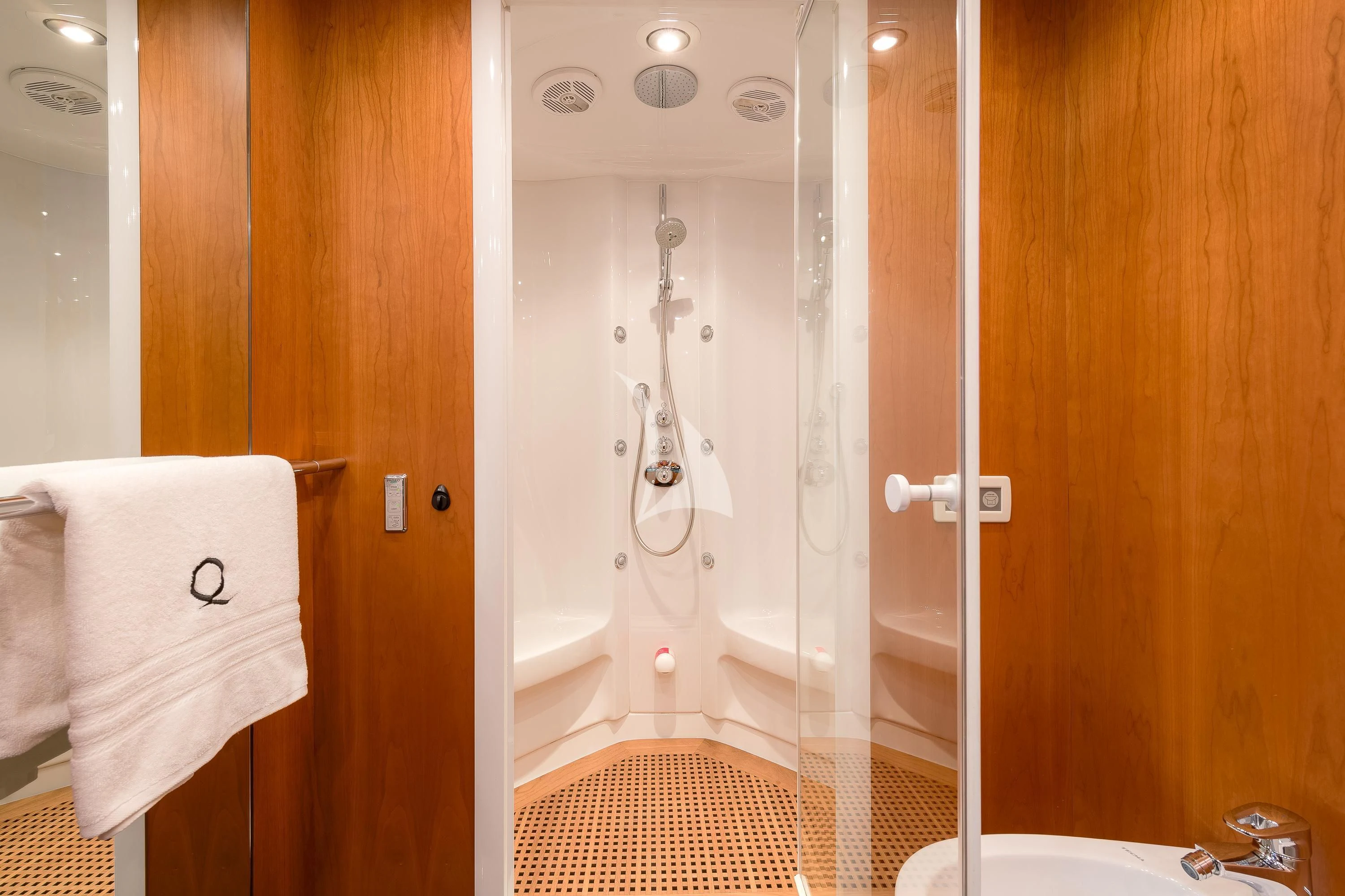 a bathroom with a shower and a sink aboard QUANTUM Yacht for Sale