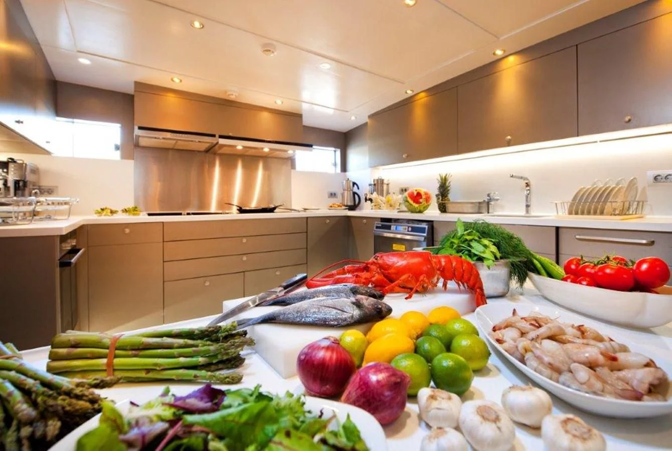 a kitchen with food on the table aboard MERMAID Yacht for Sale