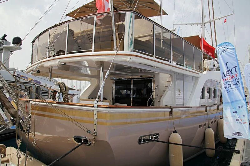 a boat with a flag on the front aboard MERMAID Yacht for Sale