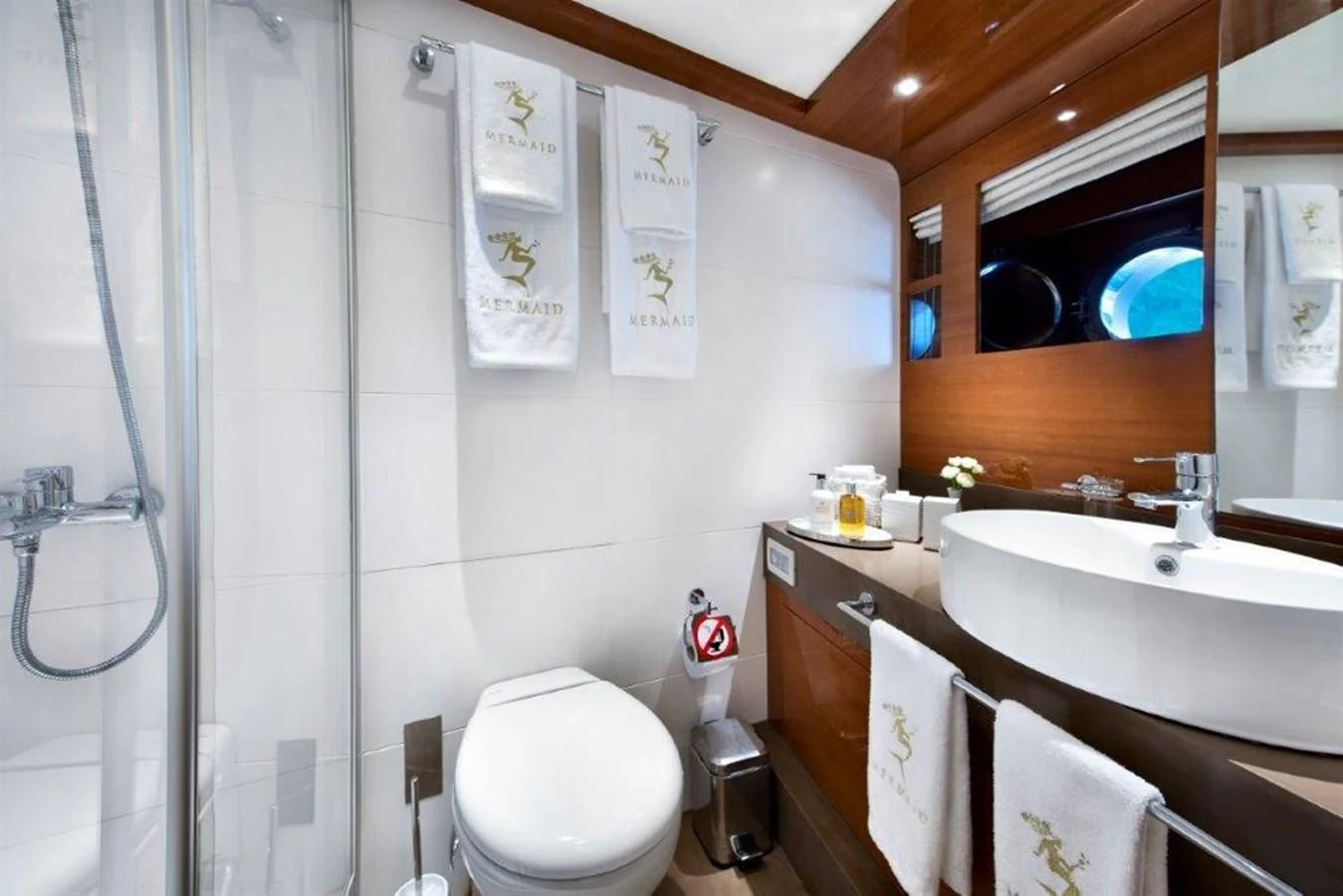 a bathroom with a sink toilet and a shower aboard MERMAID Yacht for Sale