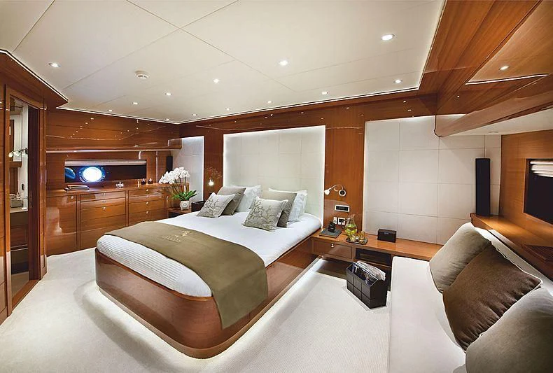 a hotel room with a bed and a couch aboard MERMAID Yacht for Sale