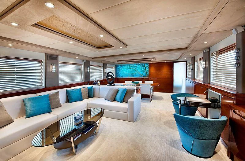 a large room with a couch and a table aboard MERMAID Yacht for Sale