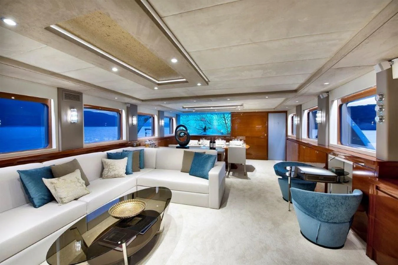 a living room with a couch and a table aboard MERMAID Yacht for Sale
